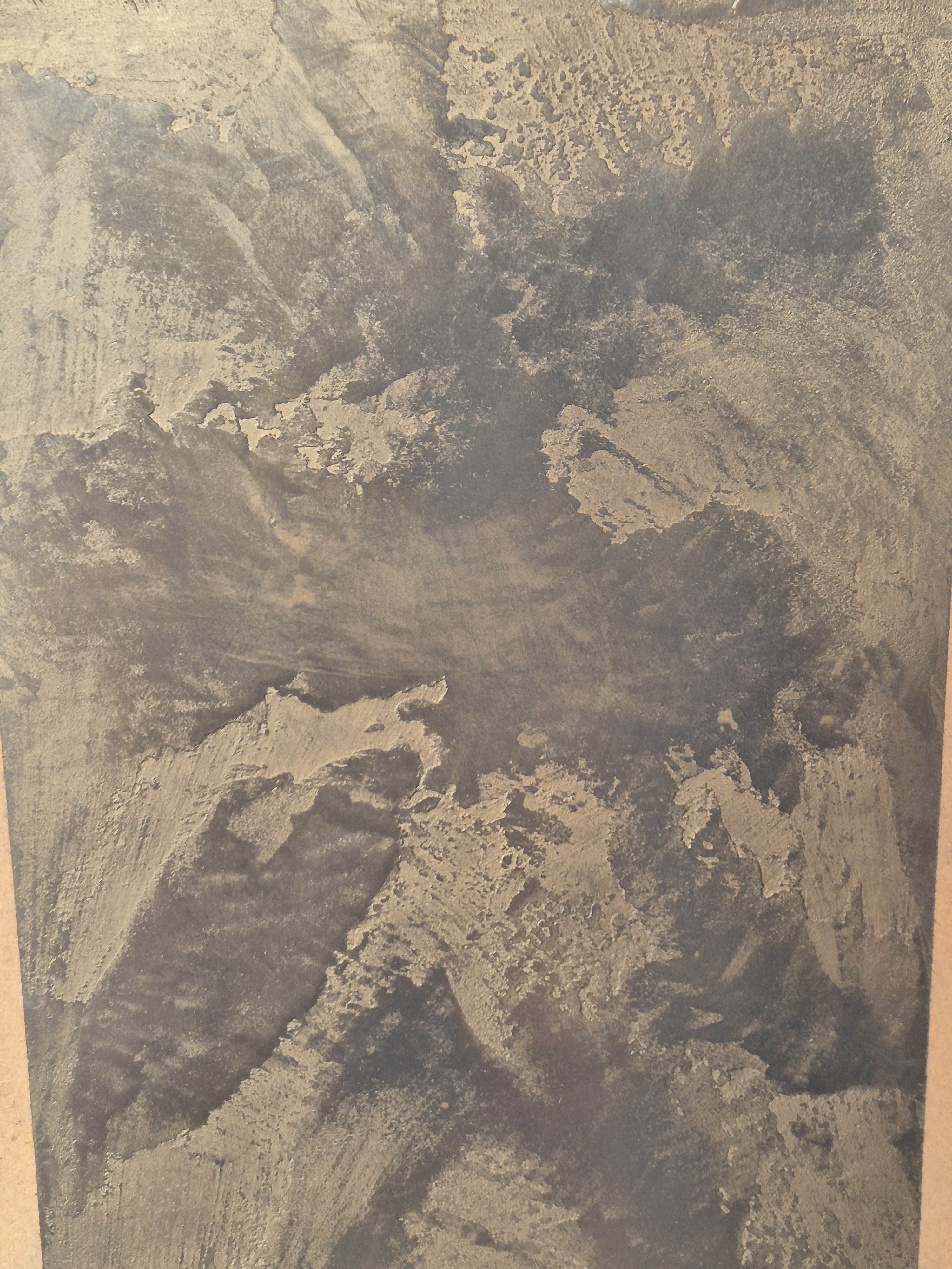 Dark charcoal polished plaster texture close-up