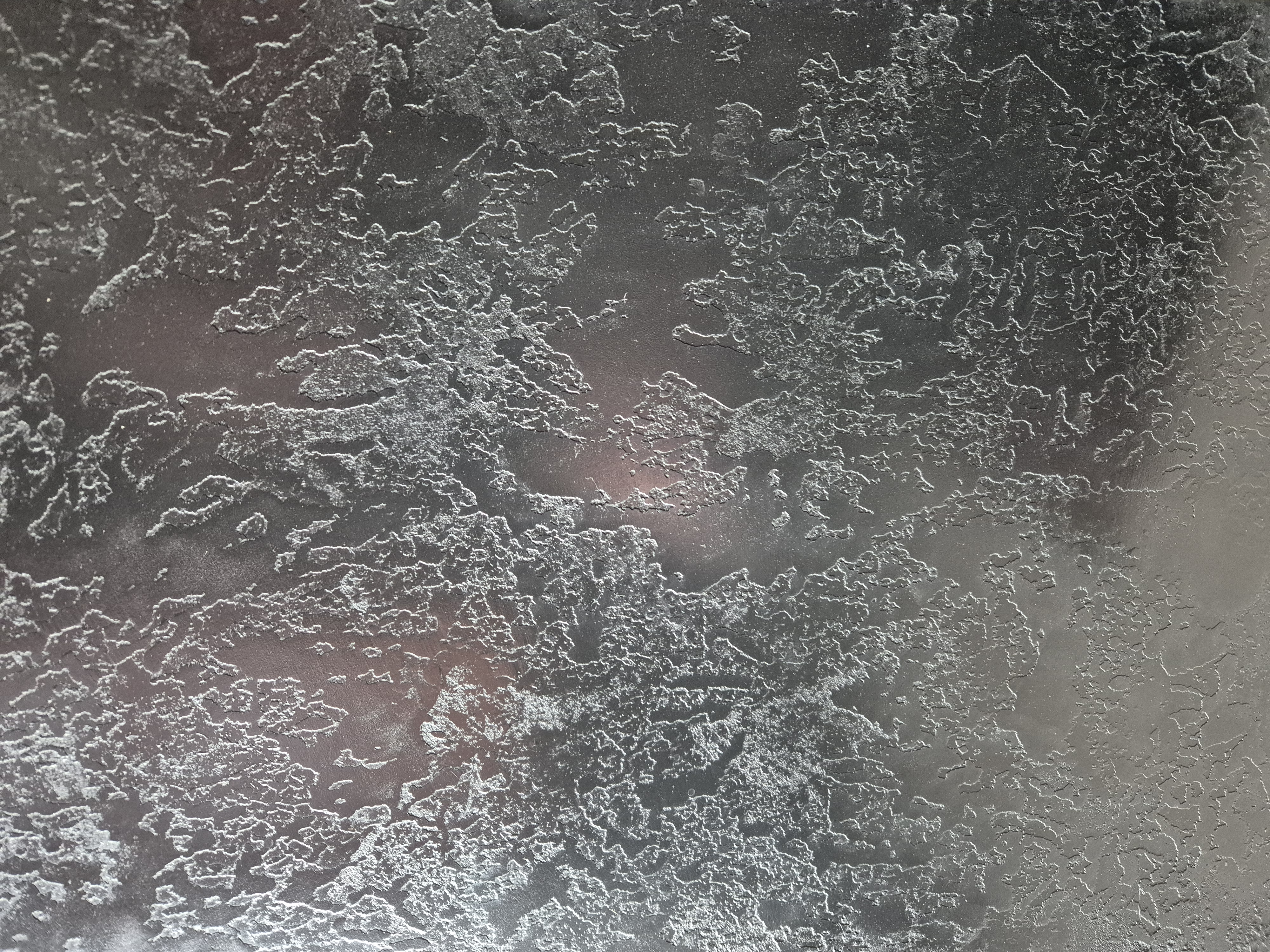 Charcoal venetian plaster with light veining detail