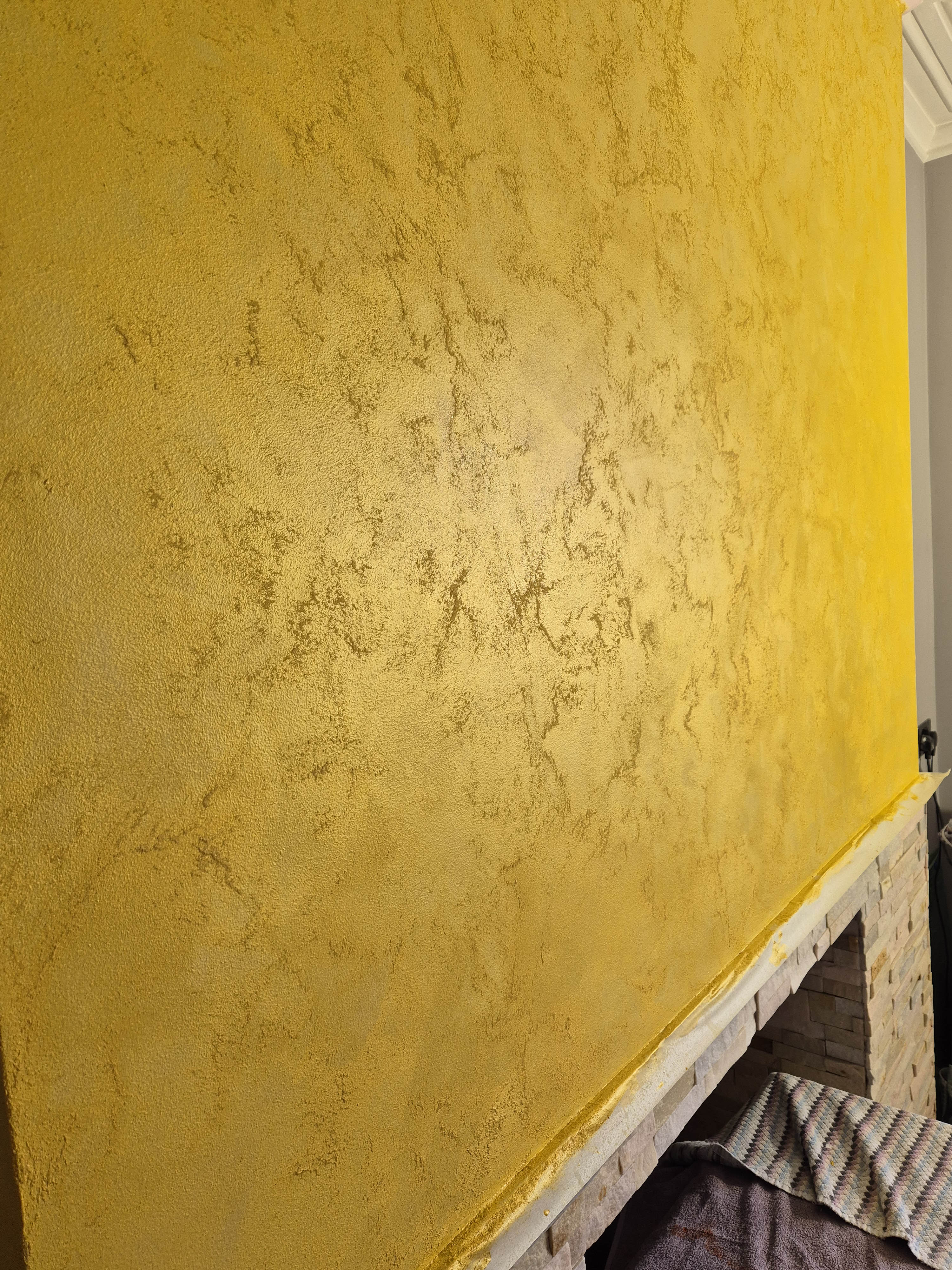 Metallic gold polished plaster feature wall finish